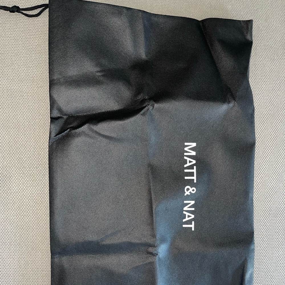 Matt and Nat black dust bag